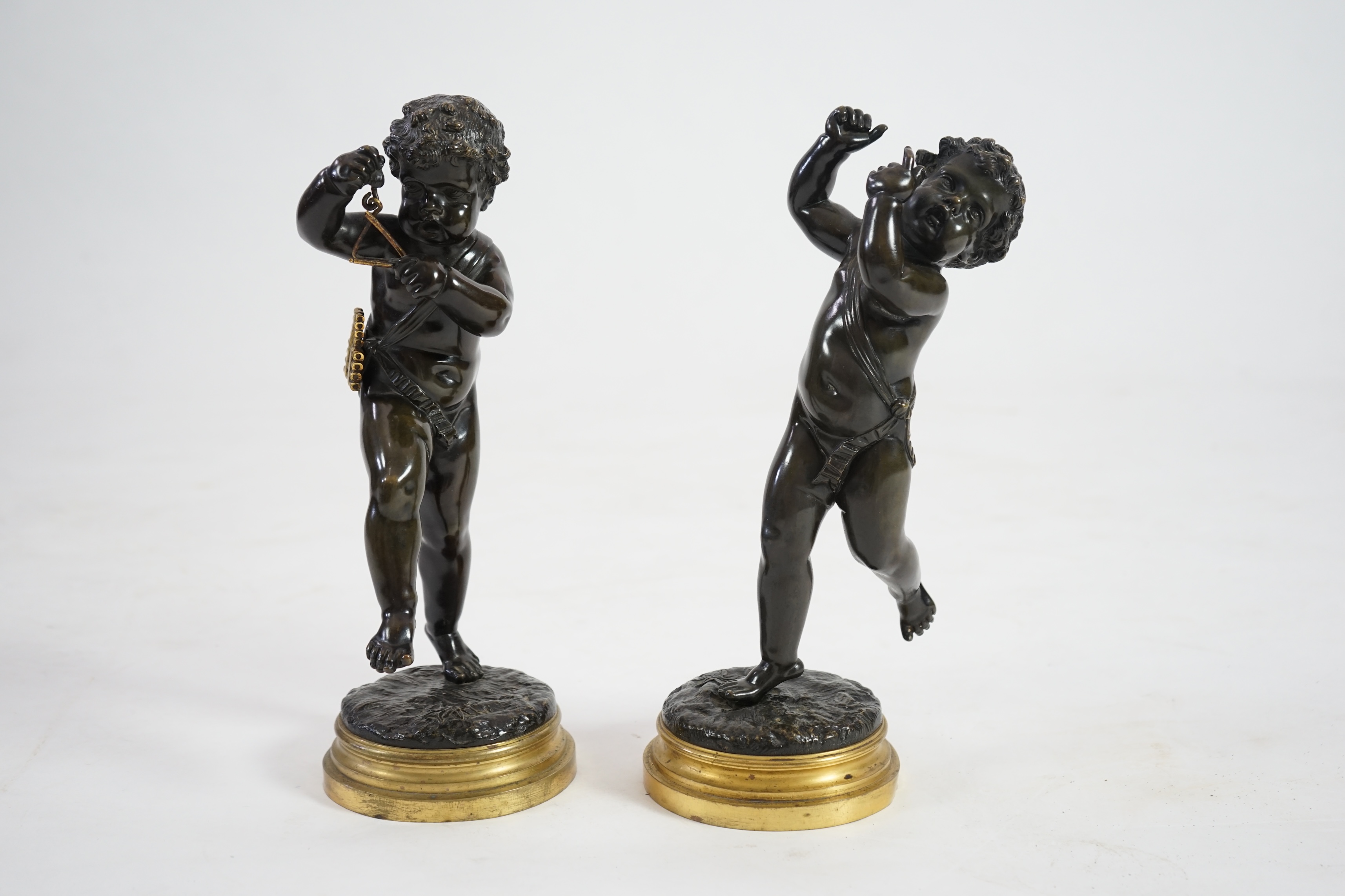 After Claude Michel Clodion (French, 1738-1814), a pair of late 19th century bronze figures of musical putti